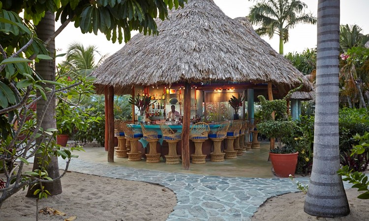 bar-full-at-dusk-chabil-mar-resort-belize-1 bar full at dusk chabil mar resort belize 1