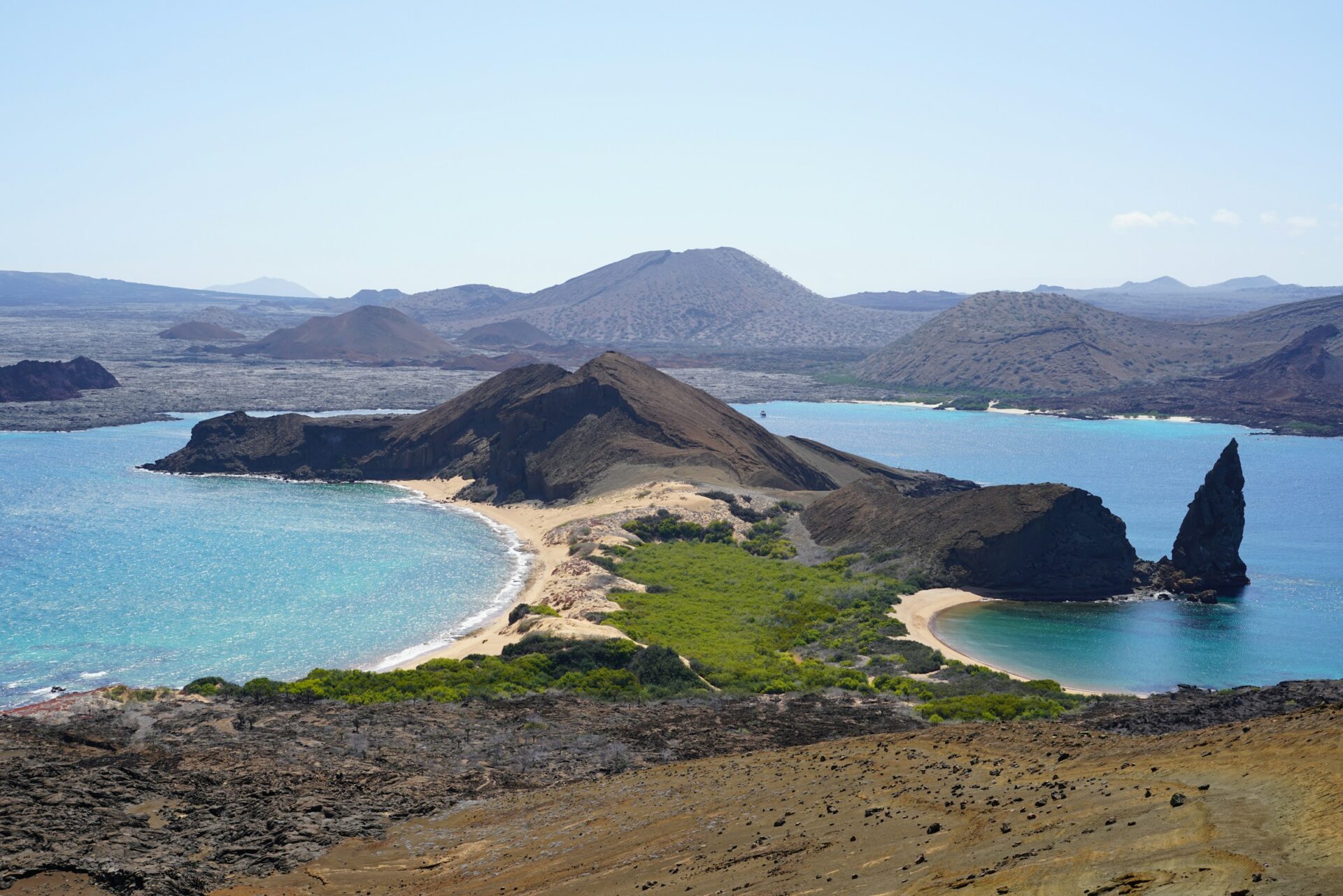 Photo by Heidi Bruce an island with a sandy beach and blue water
