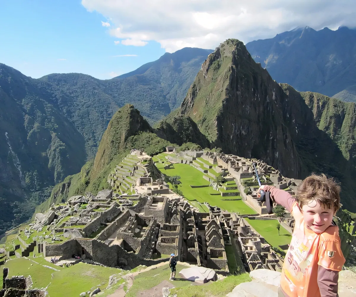 km104-child-pointing-at-machu-picchu-from-sun-gate km104 child pointing at machu picchu from sun gate 1